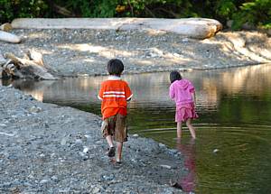 Two kids playing on the beach